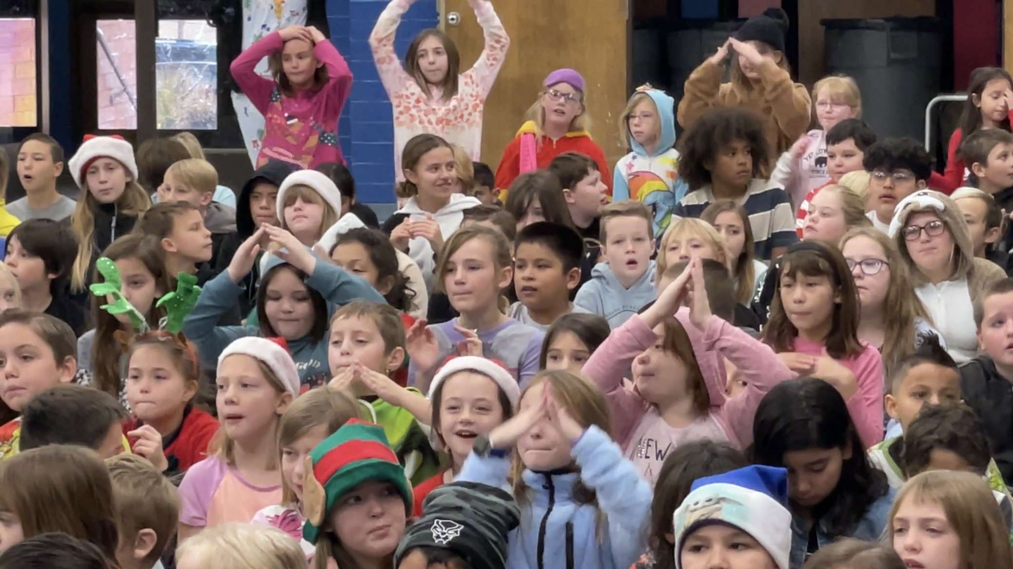 Students singing Christmas songs on the last day of school before Christmas Vacation