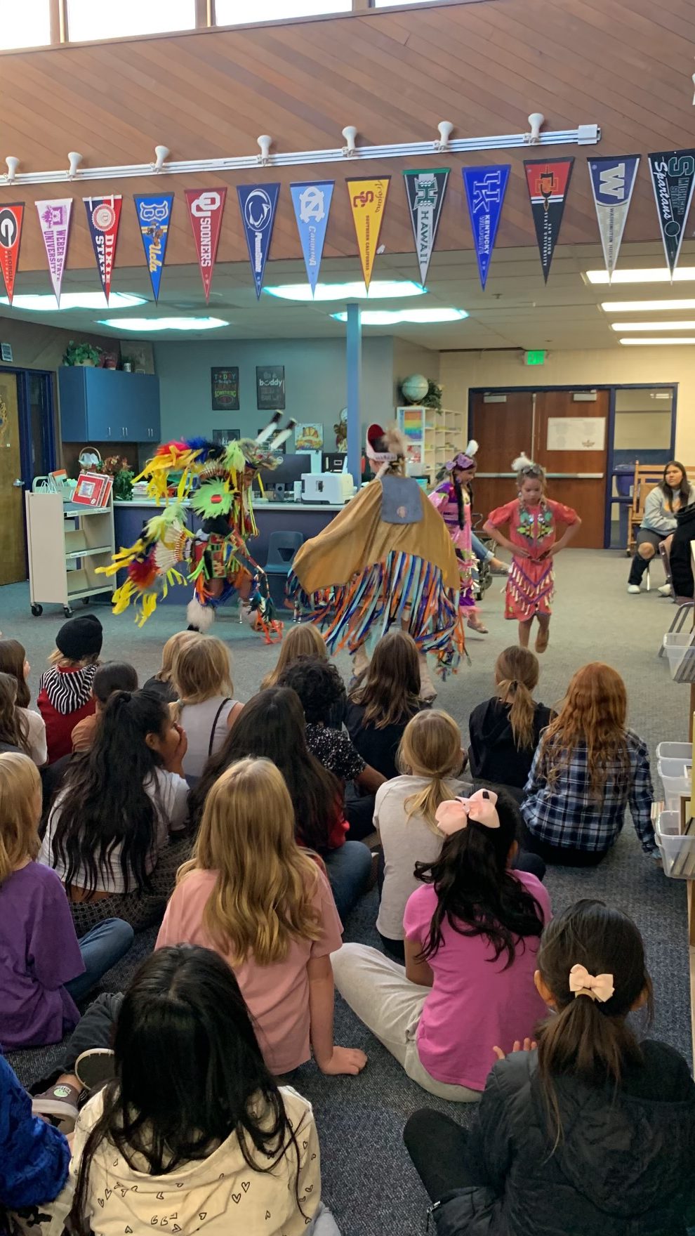 Southern Paiute Youth Group performs for 4th grade in the library